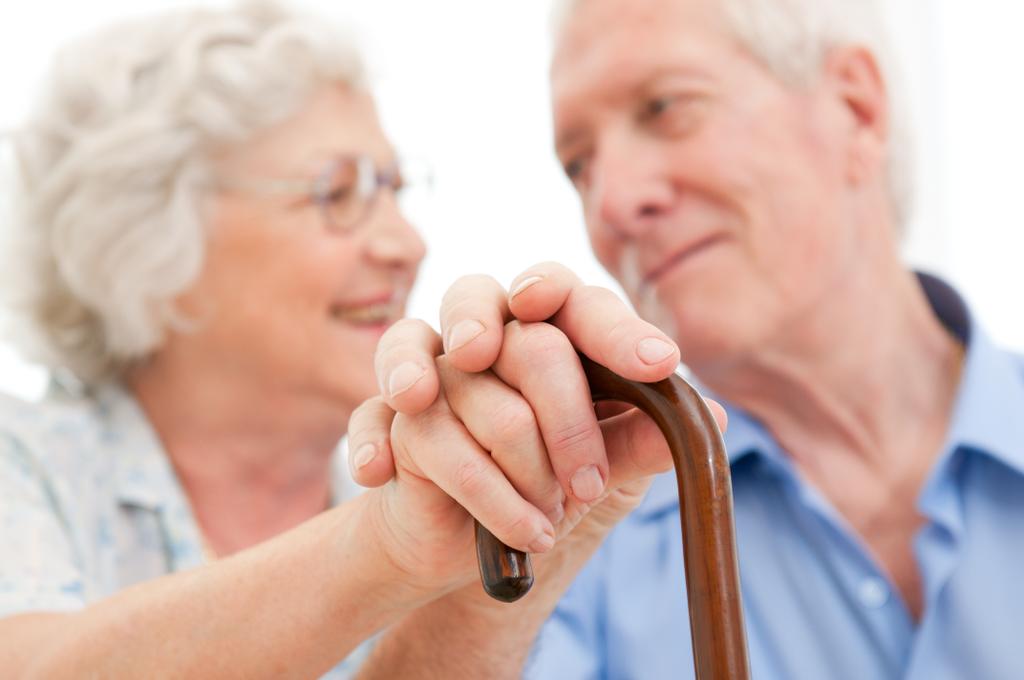 Serene aged husband and wife supporting and staying together during the old age